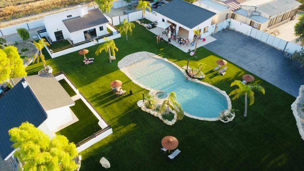 an aerial view of a house with a swimming pool at Complejo turístico en Trebujena by Villamya in Trebujena