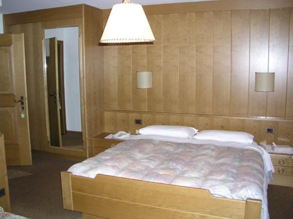 Postel nebo postele na pokoji v ubytování Hotel Garni Soreie