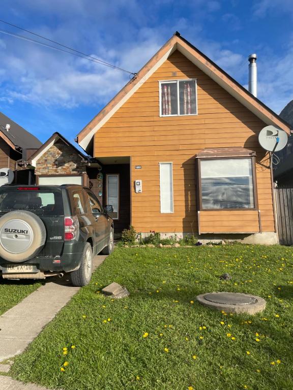 a truck parked in front of a house at Casa Mirador Coyhaique in El Cerrillo