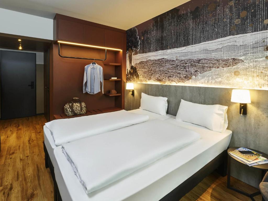 Ένα ή περισσότερα κρεβάτια σε δωμάτιο στο Ibis Styles Singen