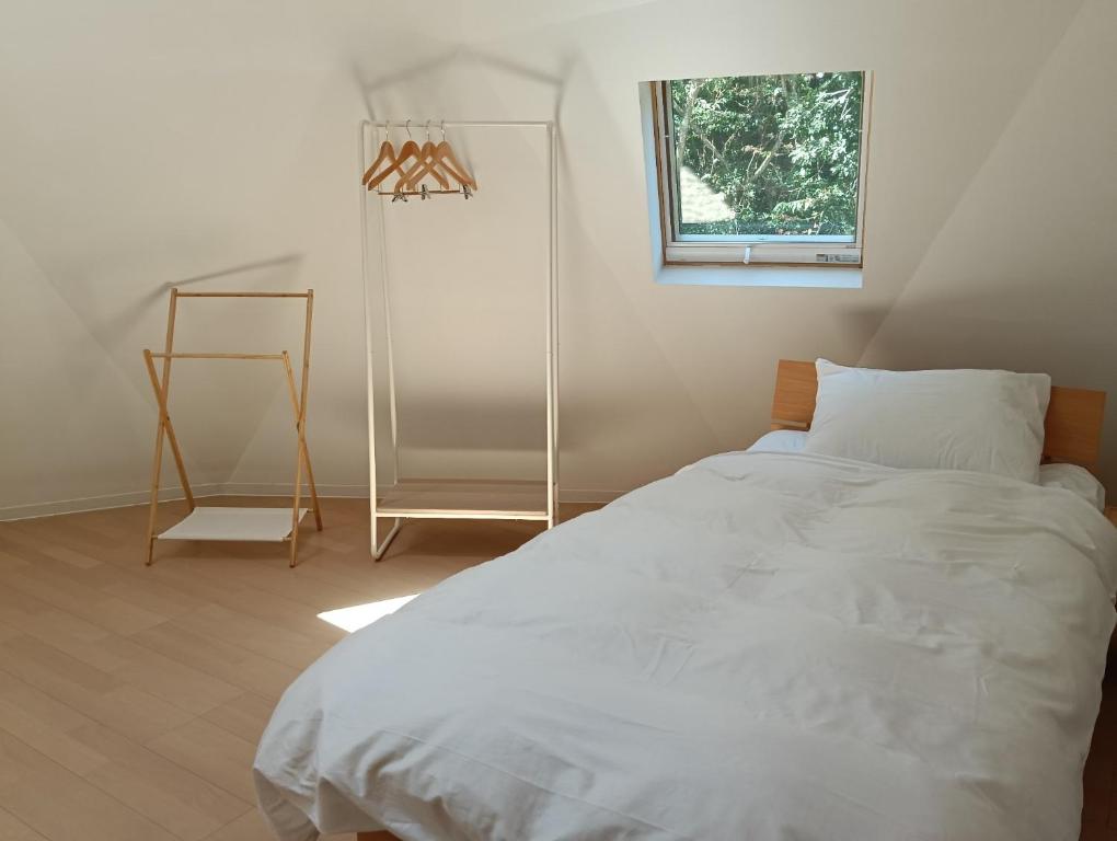 a bedroom with a white bed and a window at Star Dome - Vacation STAY 20283 in Shimoda