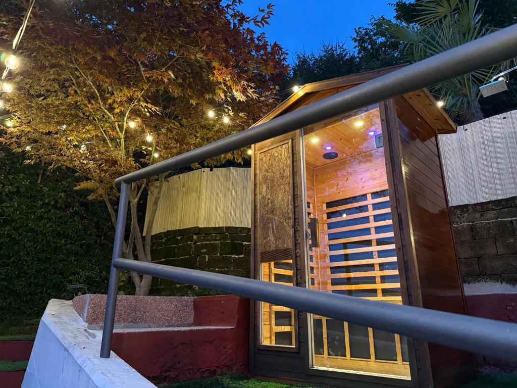 a house with a glass door at night with lights at Casa Milla - 15 min from BGY in Alzano Lombardo