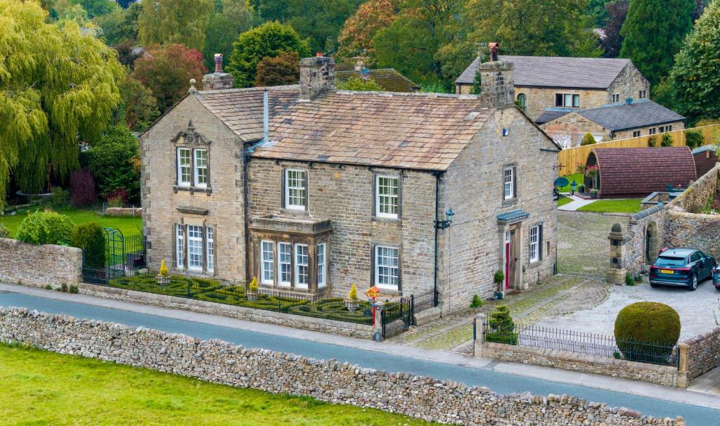 an old house on the side of a road at Westfield House in Gargrave