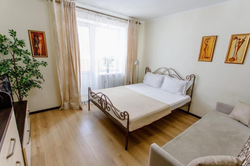 Ένα ή περισσότερα κρεβάτια σε δωμάτιο στο Novomestenskaya street