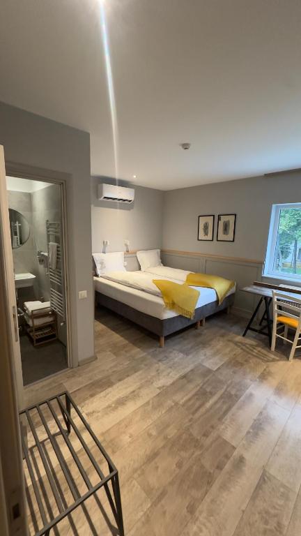 a bedroom with a large bed in a room at Villa Piazzetta in Bacău
