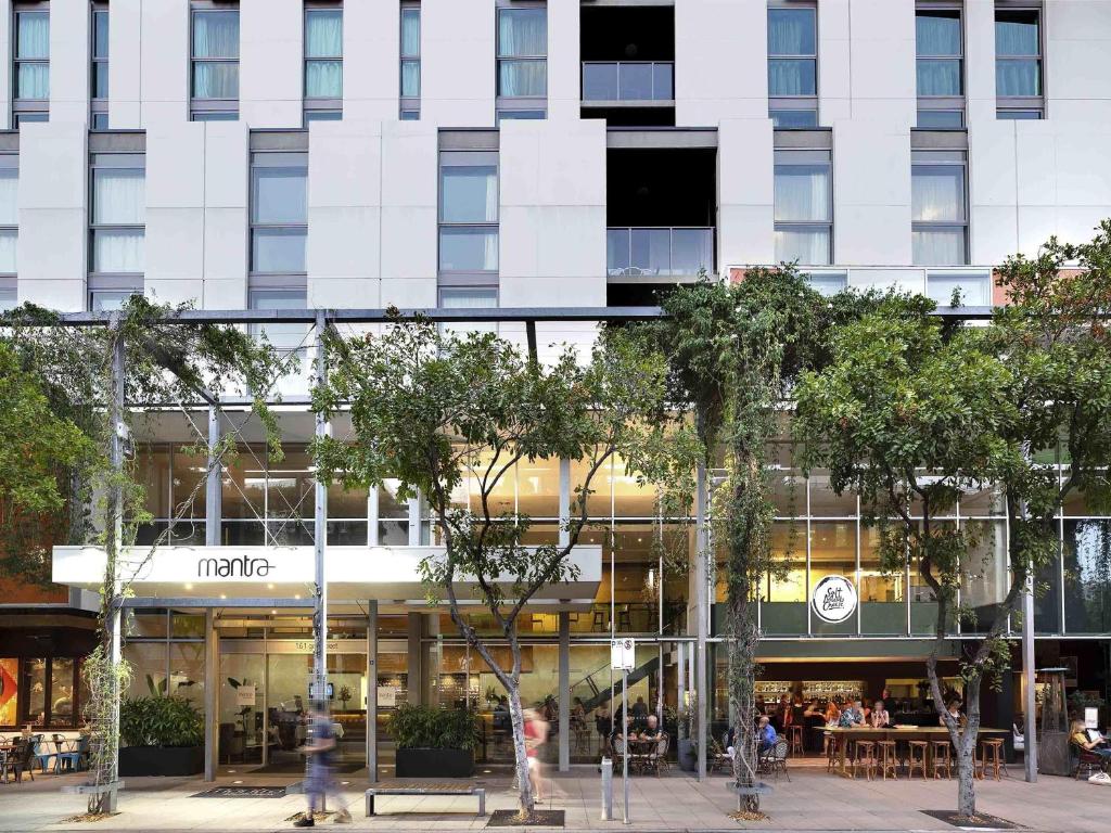 a facade of a building with people walking in front of it at Mantra South Bank Brisbane in Brisbane
