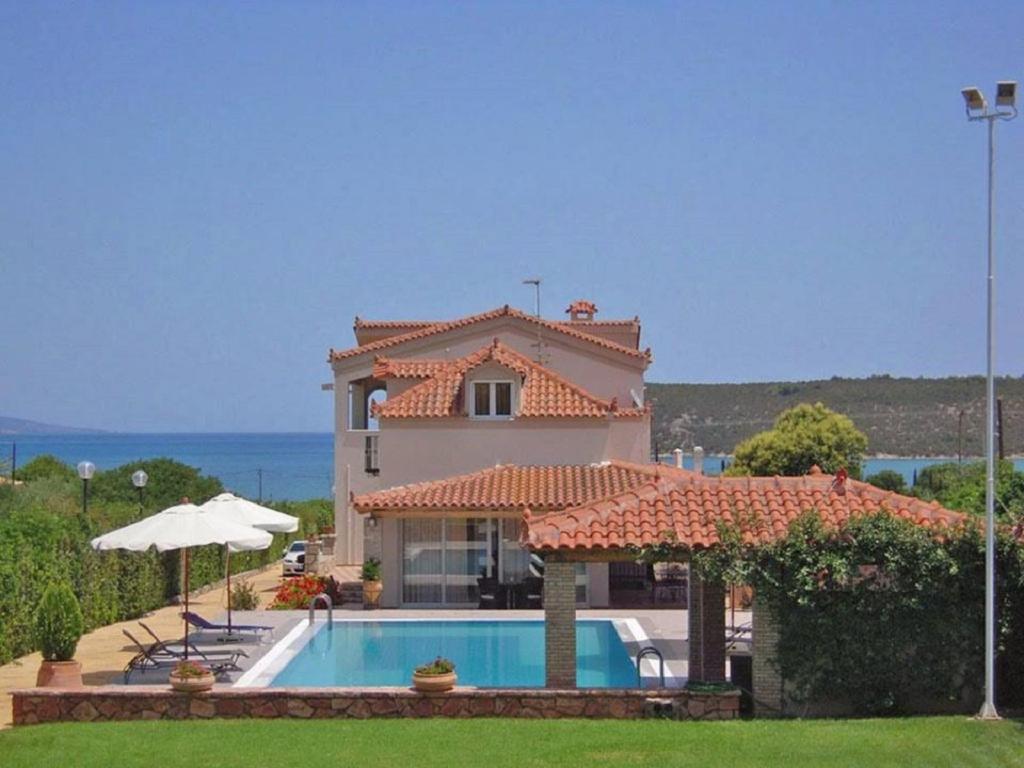 A view of the pool at Ermioni Villas or nearby