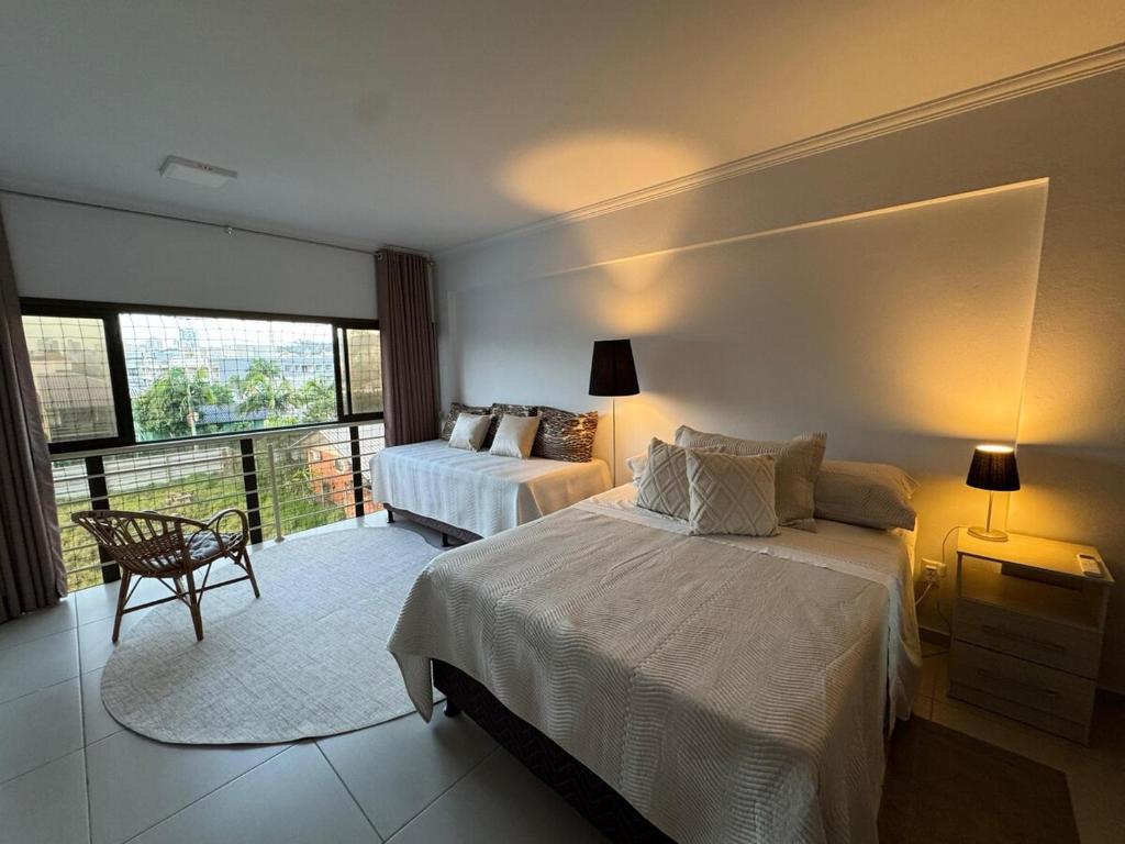 Ένα ή περισσότερα κρεβάτια σε δωμάτιο στο Duplex Comfort Torres RS