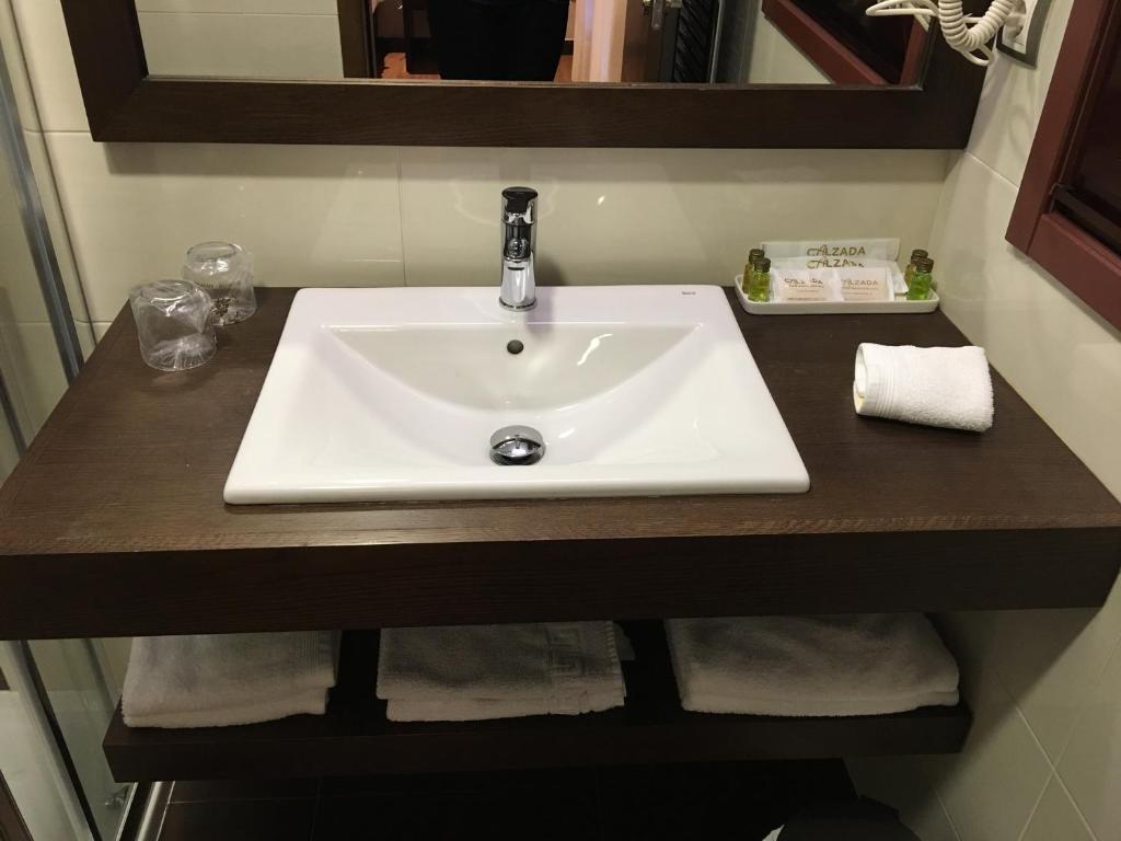 Koupelna v ubytování Hotel Calzada
