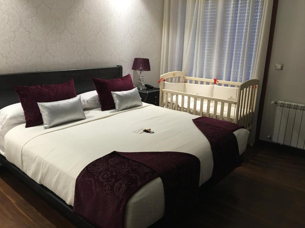 Postel nebo postele na pokoji v ubytování Hotel Calzada
