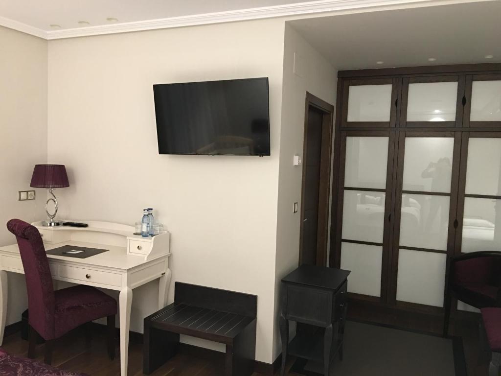 TV a/nebo společenská místnost v ubytování Hotel Calzada