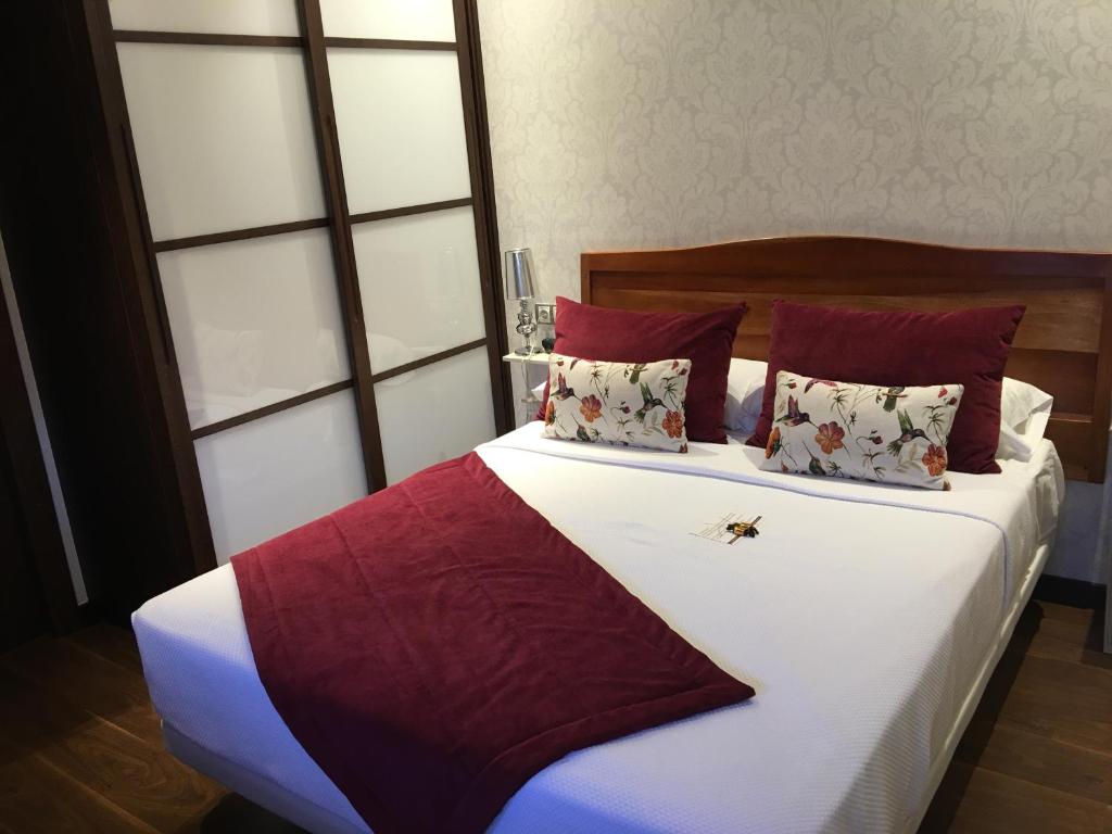 Postel nebo postele na pokoji v ubytování Hotel Calzada
