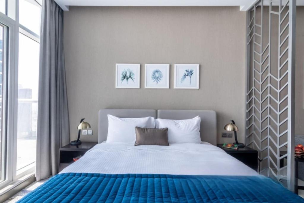 Ένα ή περισσότερα κρεβάτια σε δωμάτιο στο The Grid Studio