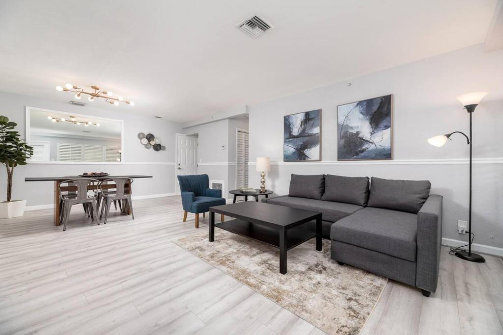 a living room with a couch and a table at The Residences at Lake Ridge Apt 1 in Fort Lauderdale