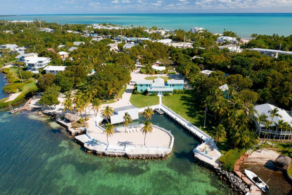 an aerial view of a resort on the water at Sprawling Bayfront Estate in Heart of Islamorada with Dockage, Beach, Pool, Kayaks, Bikes and More! in Islamorada
