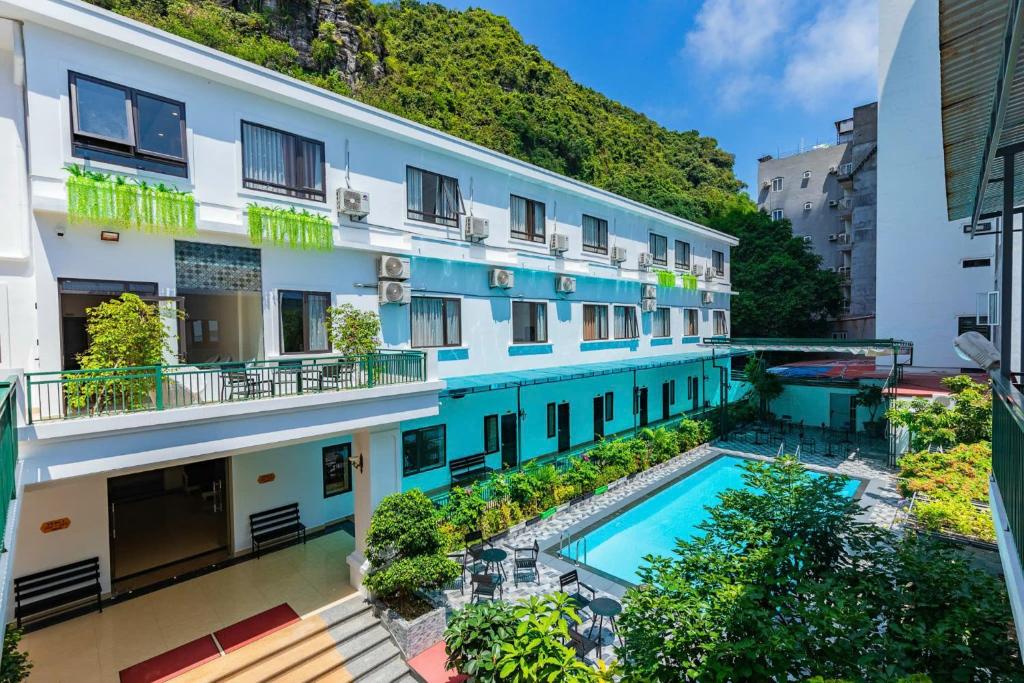 an overhead view of a building with a swimming pool at Cat Ba island Budget Pool Stay in Cat Ba