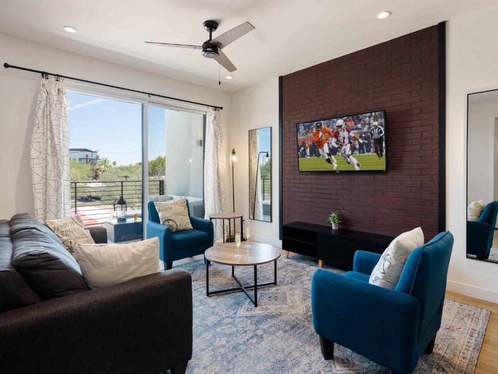 a living room with a couch and chairs at HiRise - Modern Luxe - Jacuzzi - Heart of Old Town in Scottsdale