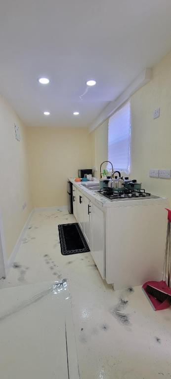a kitchen being remodeled with a stove in it at Peaceful in Town in Saint Georgeʼs