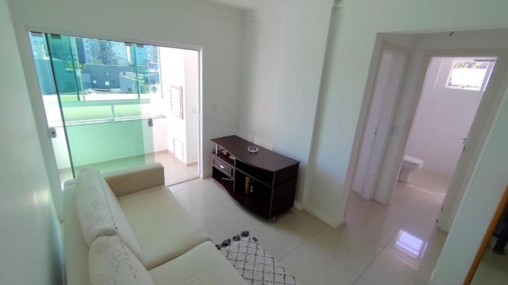 Χώρος καθιστικού στο Apartamento com suite