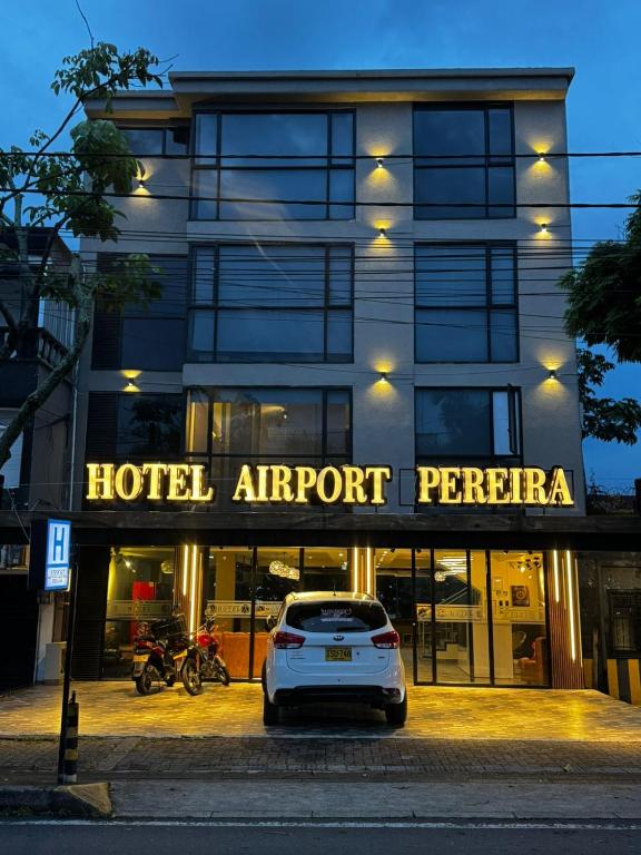 a car parked in front of a hotel airport perrar at HOTEl AIRPORT PEREIRA in Pereira