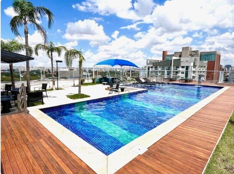 a swimming pool on the roof of a building at Wise SP Expo Center e Anhembi in Sao Paulo