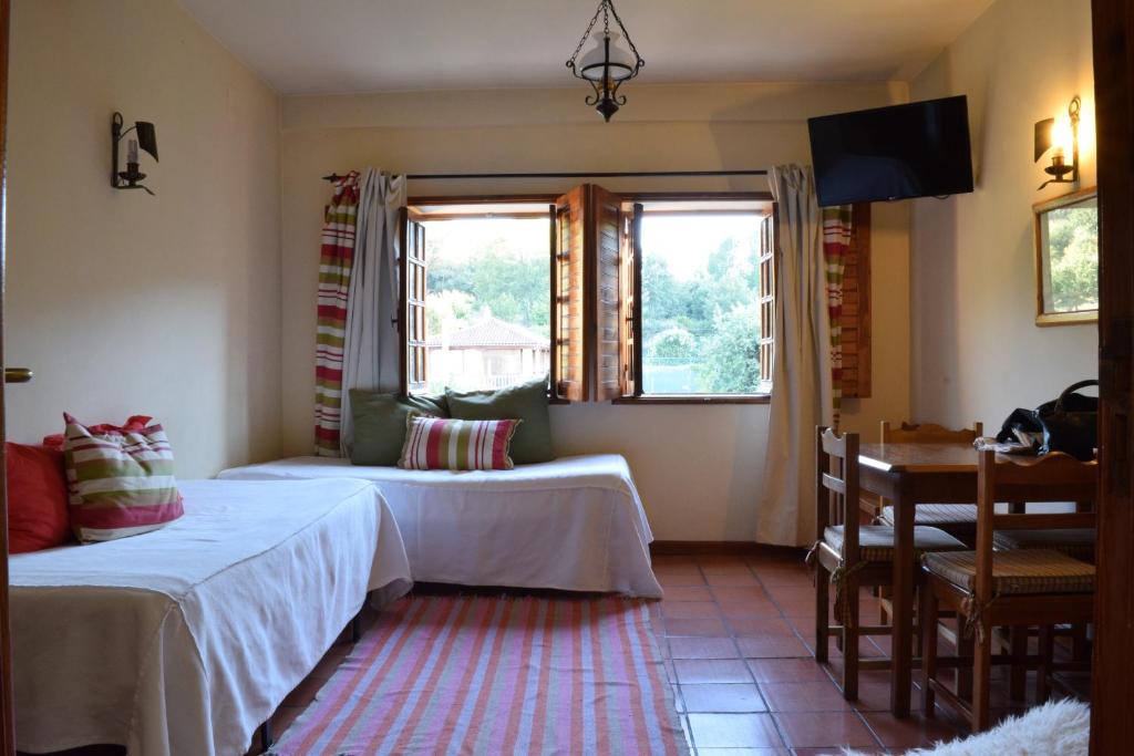 Postel nebo postele na pokoji v ubytování Quinta Do Crestelo Aparthotel