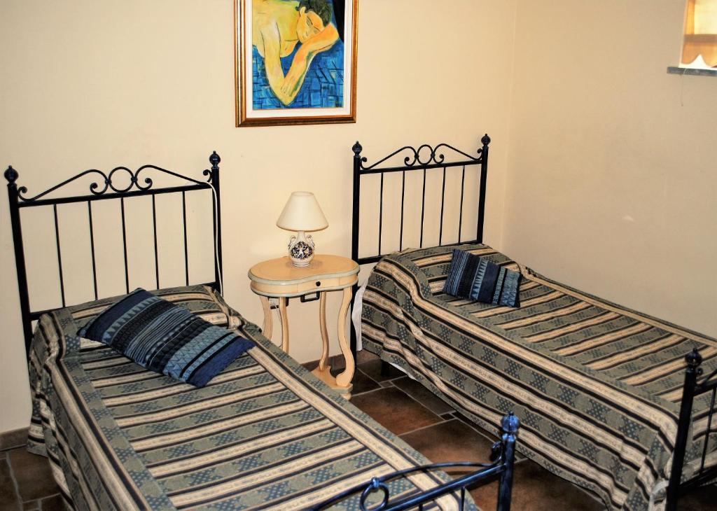 Postel nebo postele na pokoji v ubytování Rosso Di Sera
