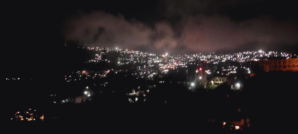 a view of a city lit up at night at VHP luxury cottage kodaikkanal in Kodaikānāl