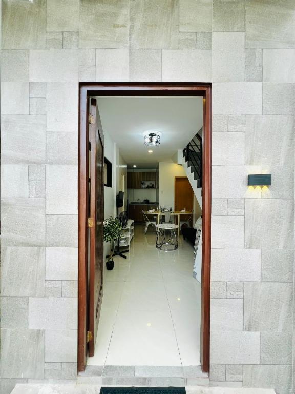 a hallway leading to a living room and a dining room at 4BR House in Pardo Cebu Perfect for Groups in Cebu City