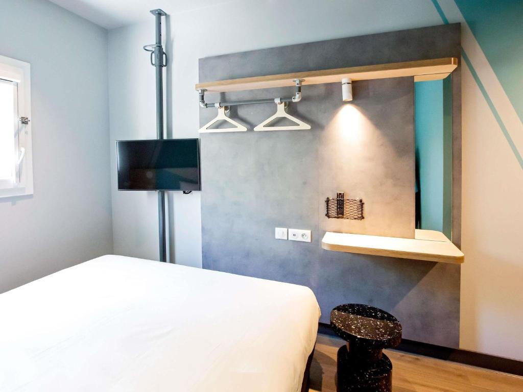 Кровать или кровати в номере Hotel Ibis Budget Montpellier Centre Millenaire -