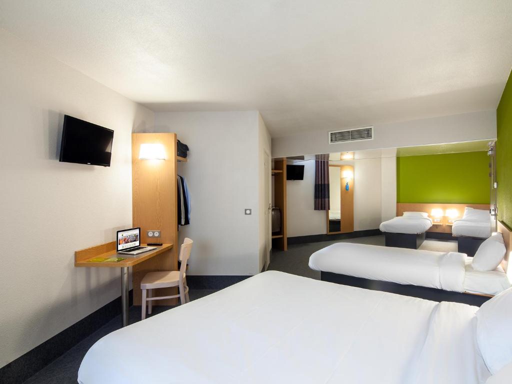 Postel nebo postele na pokoji v ubytování B&B HOTEL Montpellier Centre Le Millénaire