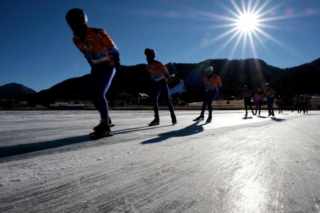 a group of people skateboarding on the road at SeeHotel & SeeApartments Kärntnerhof- direkt am See! in Weissensee