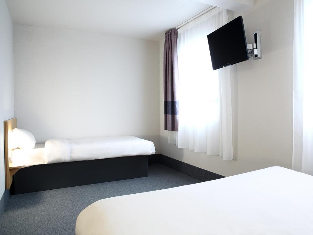Postel nebo postele na pokoji v ubytování B&B HOTEL Perpignan Sud Marché International