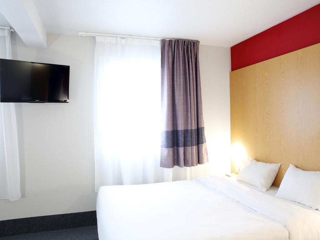 Postel nebo postele na pokoji v ubytování B&B HOTEL Perpignan Sud Marché International