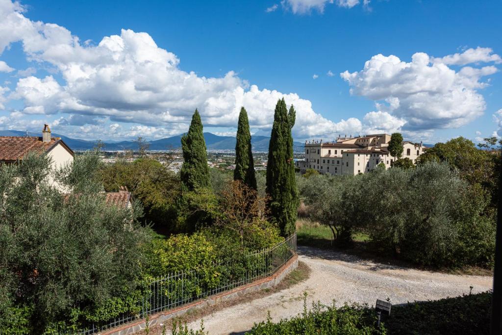 a view of a town with trees and buildings at Villa Bianca in Scandicci