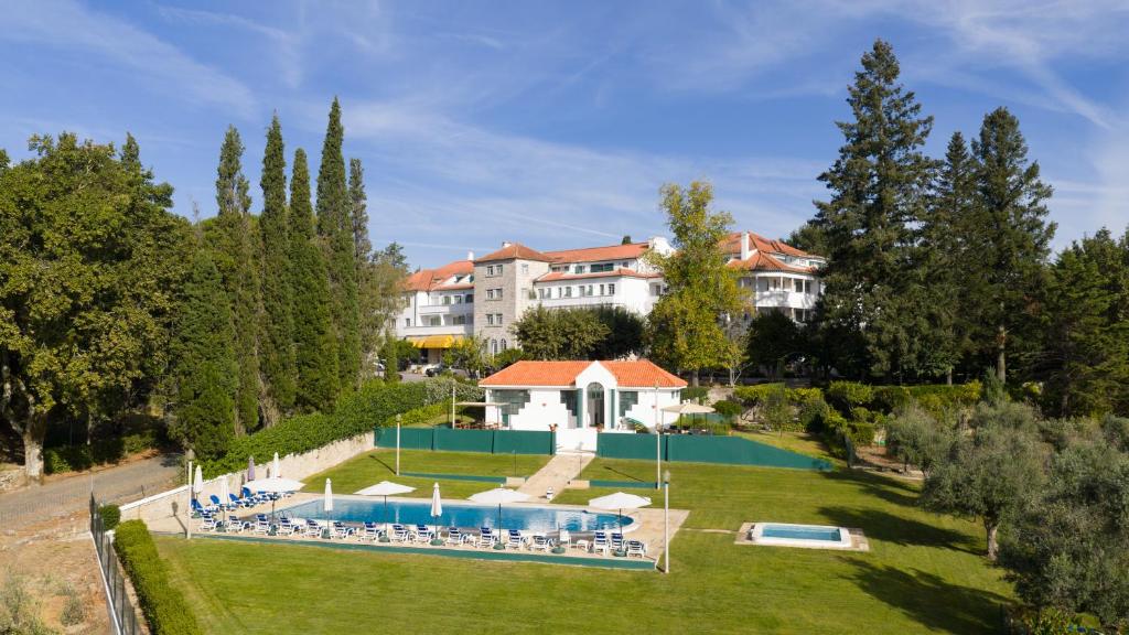 an aerial view of a resort with a swimming pool at Hotel Urgeirica in Nelas