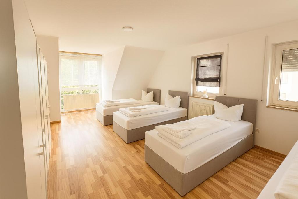 Postel nebo postele na pokoji v ubytování SUNNYHOME Monteurwohnungen und Apartments in Nittendorf