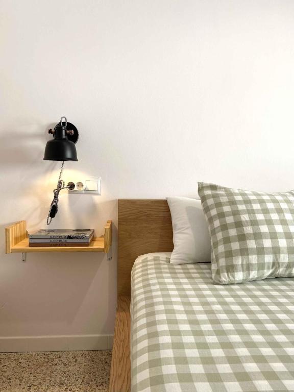 a bedroom with a bed and a lamp on a shelf at Casa Soñiga - Congost de Montrebei in Tolva
