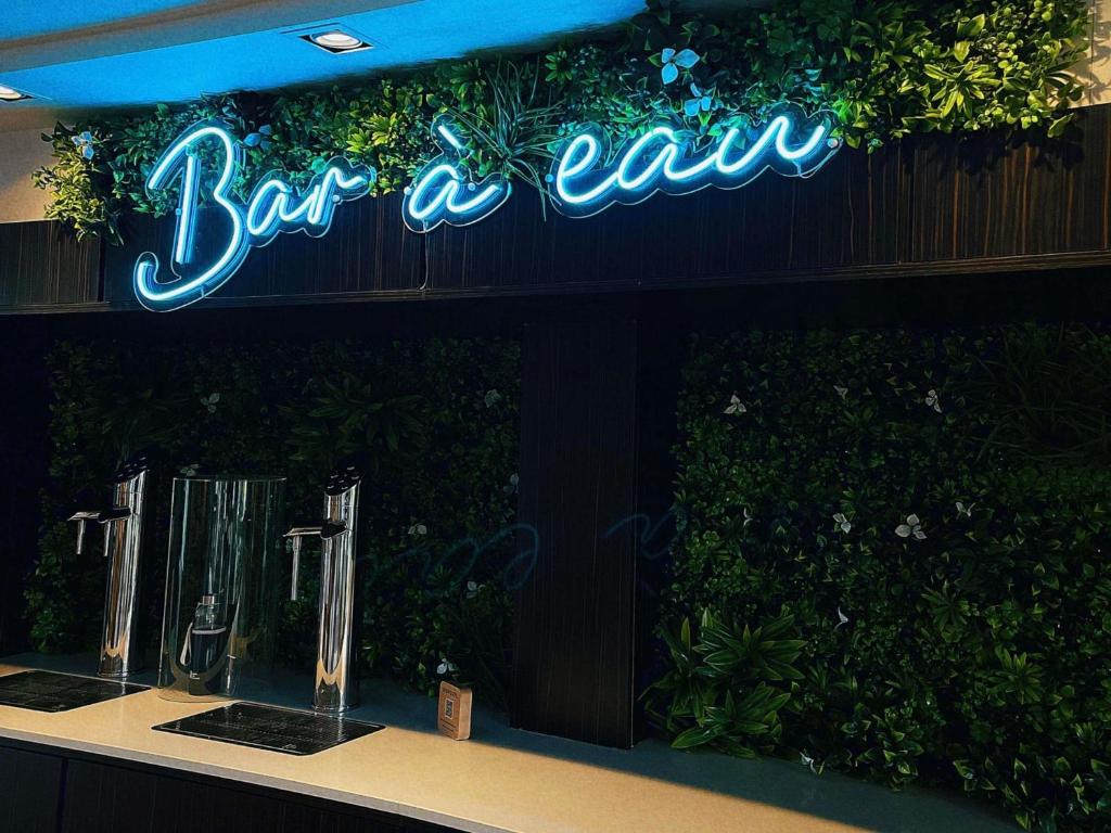 a sign that says bar aah on a wall at Novotel Bordeaux Lac in Bordeaux
