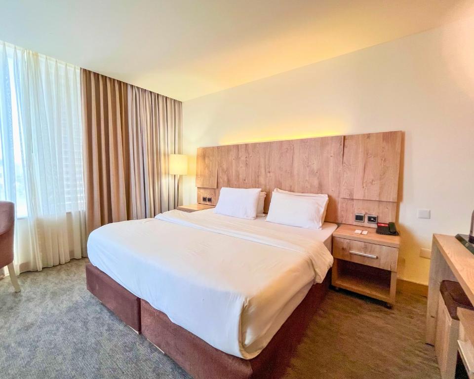 Postel nebo postele na pokoji v ubytování La Casa Hotel Amman by FHM