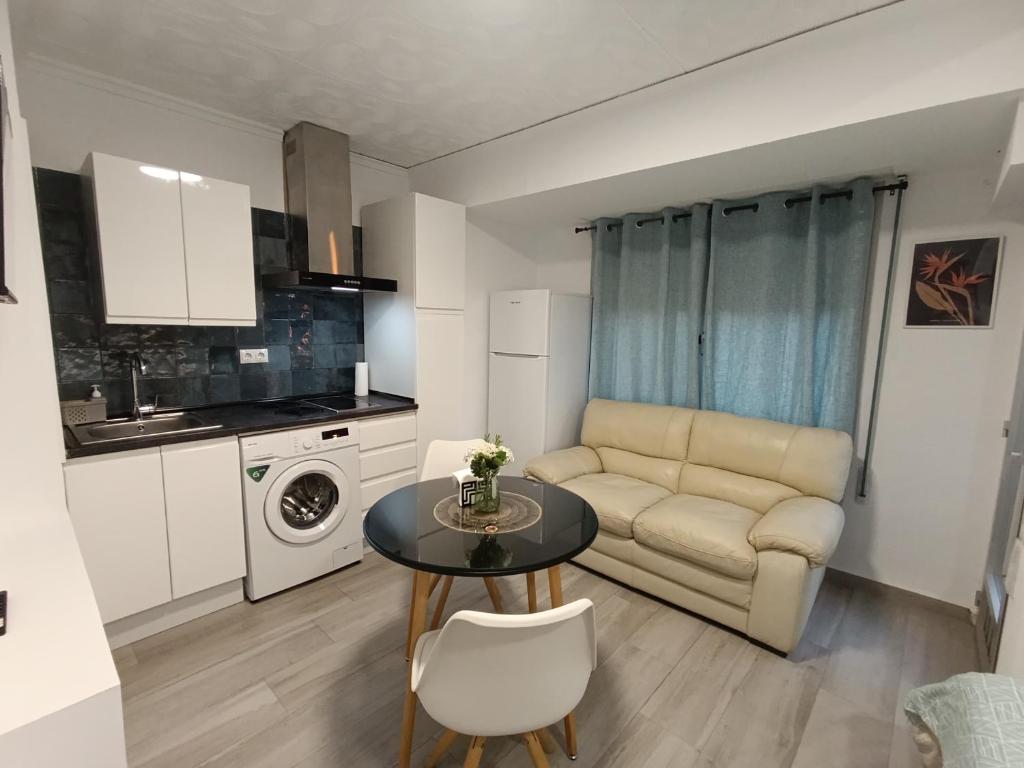 a small living room with a table and a couch at ESTUDIO Villarreal in Villareal