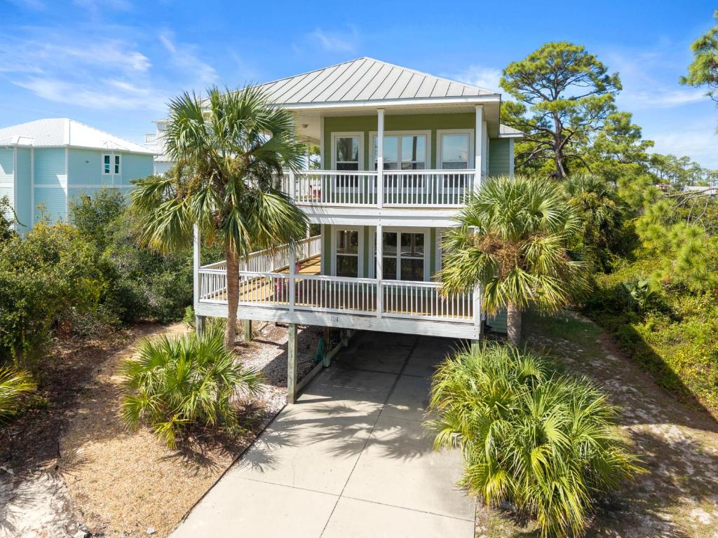 an aerial view of a house with palm trees at Cape Palms in Port Saint Joe