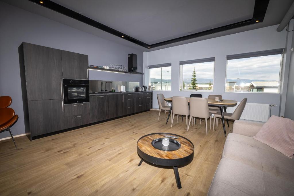 a living room with a couch and a table at LL Properties - TB24 Nest in the North in Akureyri