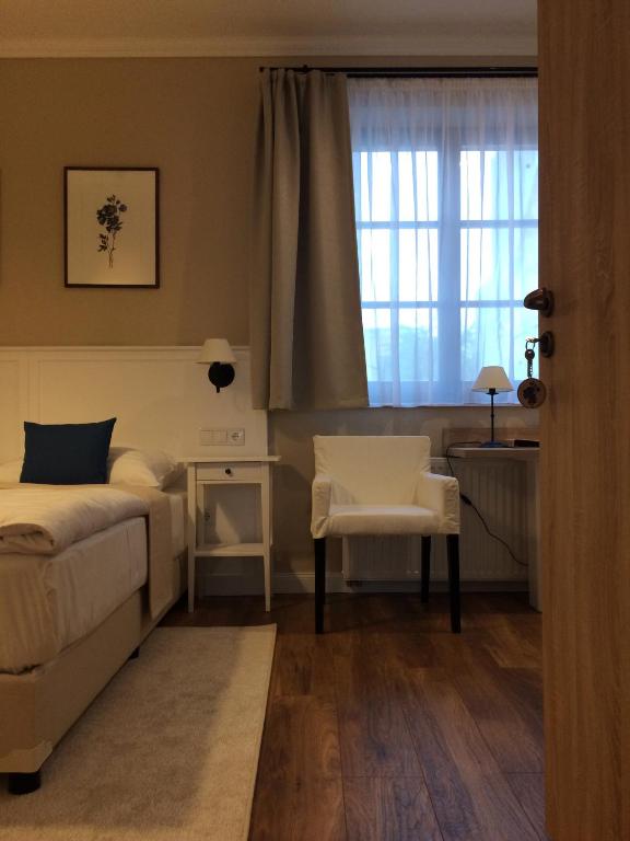 Postel nebo postele na pokoji v ubytování Erhardt Superior Rooms