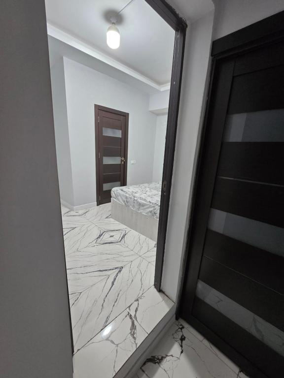 a bedroom with a mirror and a bed in a room at Resta hostel in Yerevan