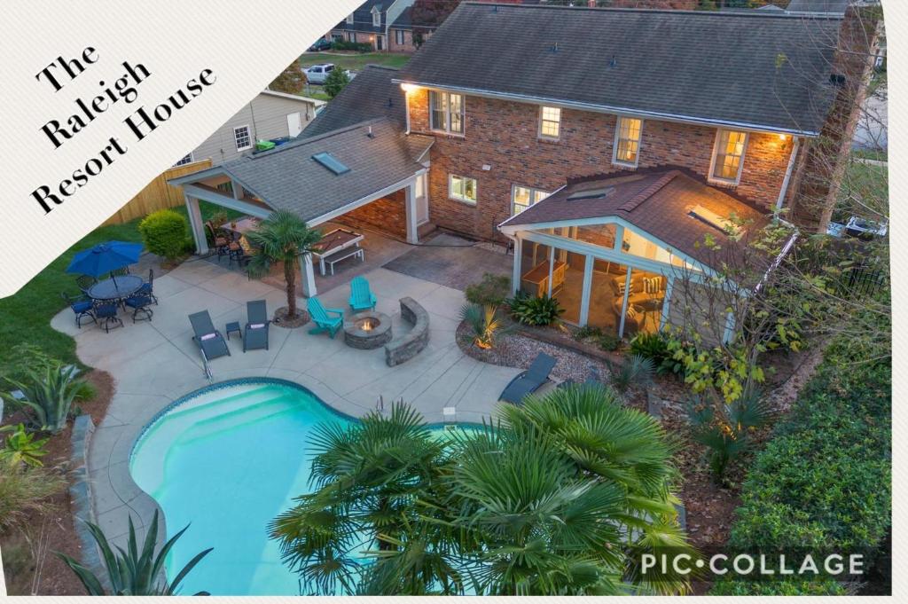 an aerial view of a house with a swimming pool at The Raleigh Resort House in Millbrook