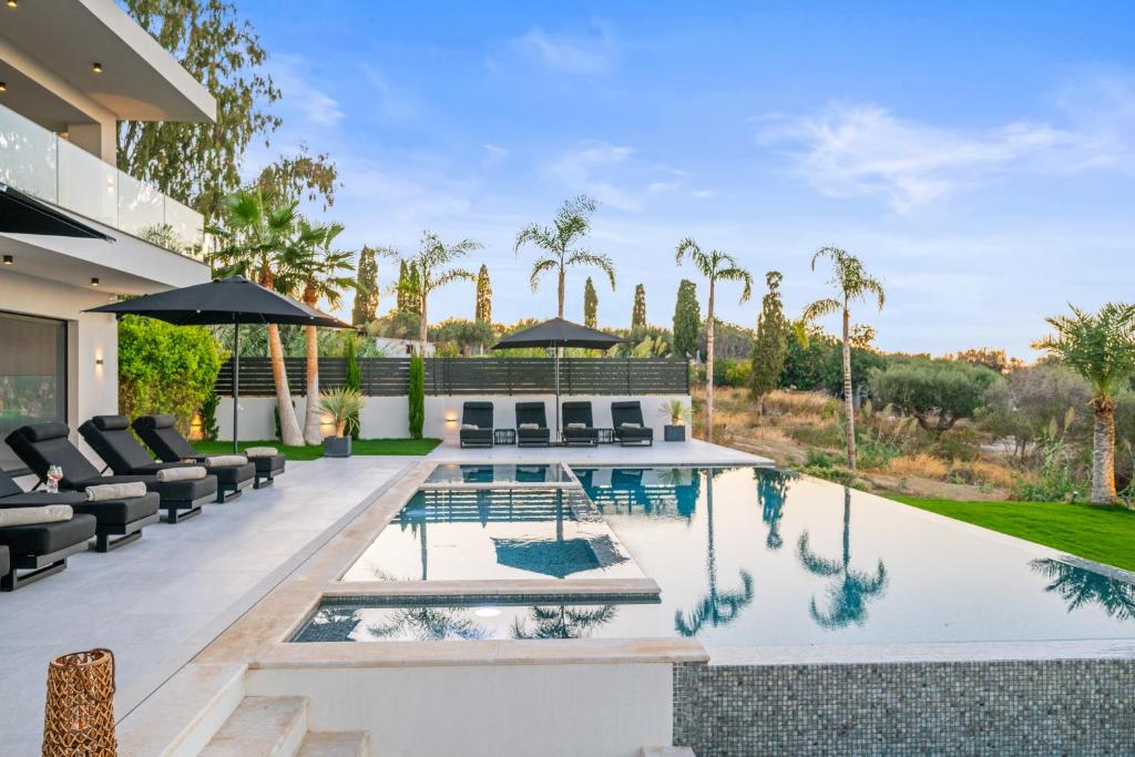 an image of a swimming pool in a house at Serenity Blue Luxury Villa 7 Bedrooms in Koutouloufari