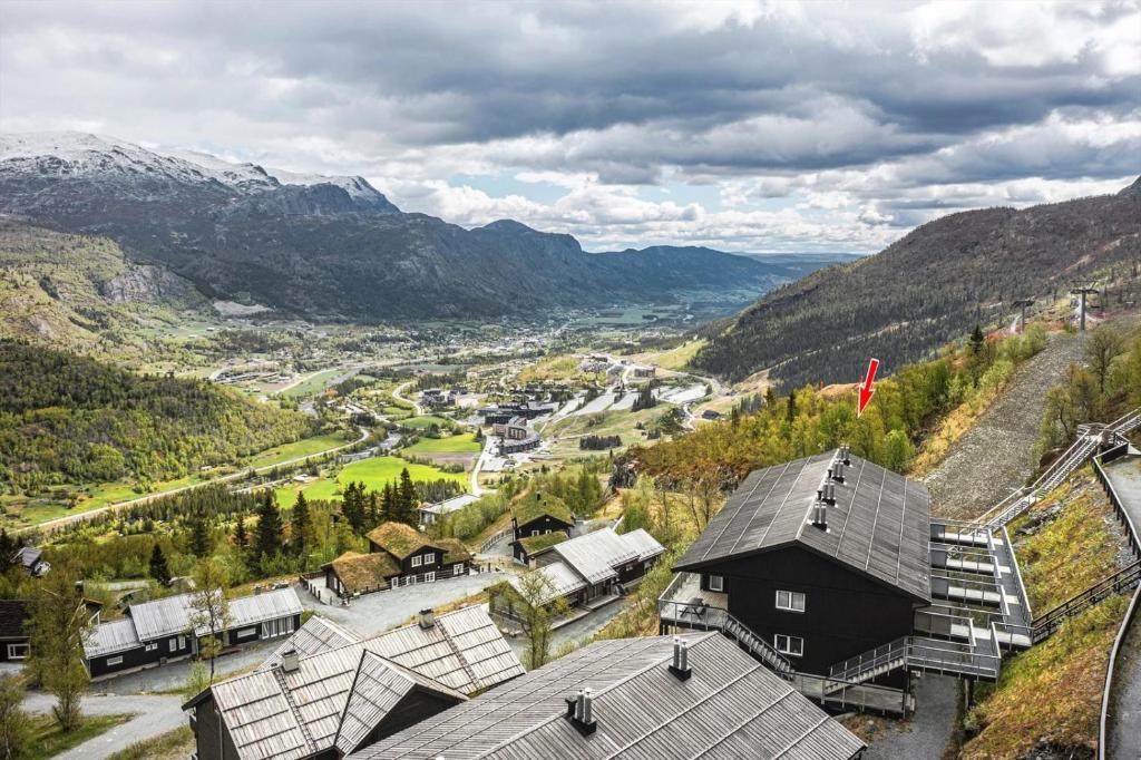 an aerial view of a village in the mountains at Large Ski in-Ski out Apartment for Groups in Hemsedal