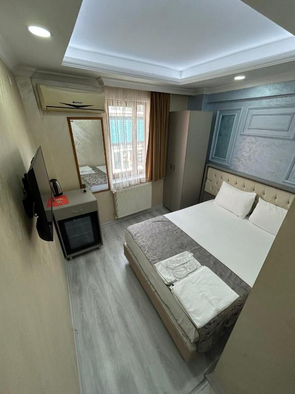 Giường trong phòng chung tại Grand Kybele Hotel