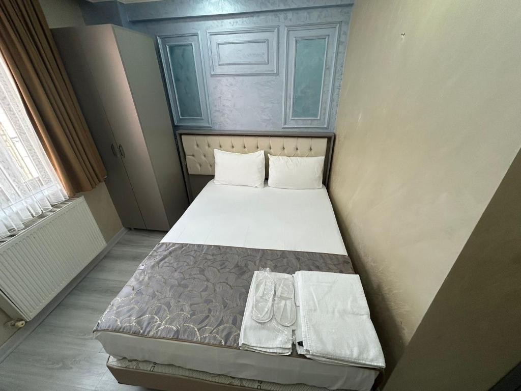 Giường trong phòng chung tại Grand Kybele Hotel
